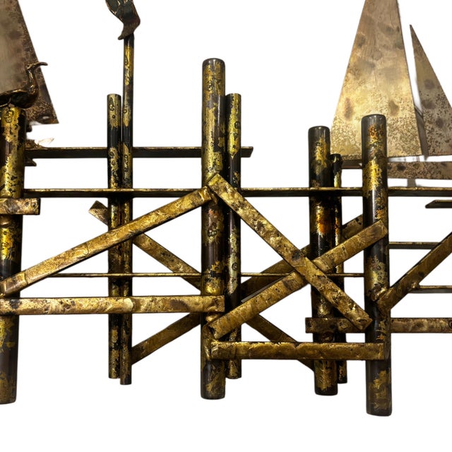 Curtis Jere brass wall sculpture, featuring sailboats, birds, and a pier. Iconic piece. It is signed on the back.