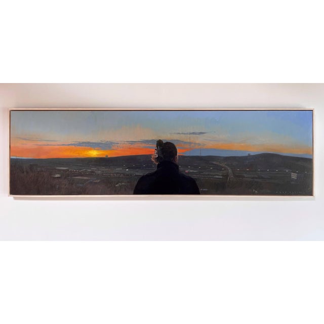 This artwork depicts a figure silhouetted against a sweeping sunset, overlooking a sprawling industrial landscape. The...