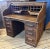 American Roll top desk with nice interior. It has 2 banks of 4 drawers and multiple drawers and compartments above. Key...