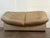 1970's tan leather loveseat by Leolux (Netherlands) in vintage condition. The sofa is faded and it have some spots...