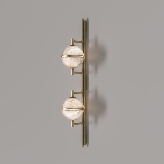 Inspired by the organic allure and enigmatic textures of coral reefs, the Andros II Wall Lamp is a celebration of light in...