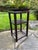 Beautiful antique lacquered Chinese 2-tier hardwood stand / end table, circa early 20th century. The table features hand-...