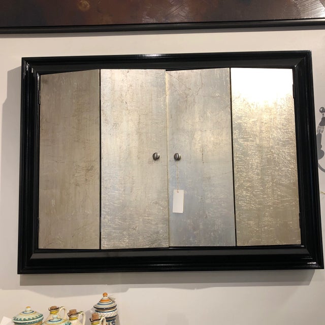 Wonderful wall mounted TV display unit with 2 hinged doors in an ebony and distressed silver finish.