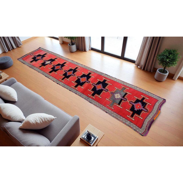Offered is a Kurdish runner rug, made in Anatolia approximately 40-50 years ago. The beautiful wool on wool mid pile...