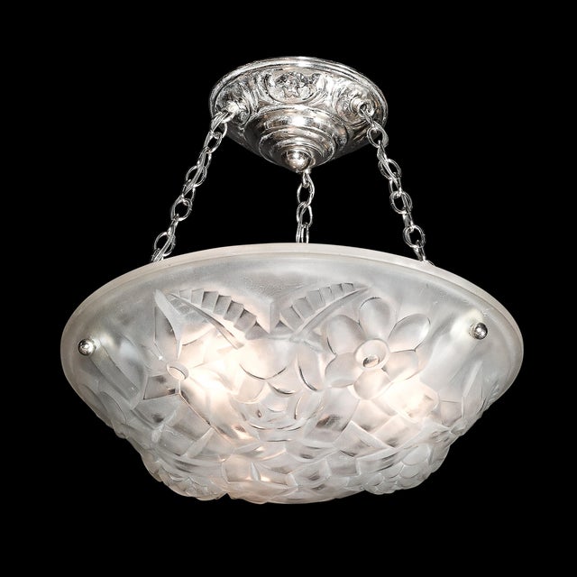 This Art Deco frosted glass floral cubist chandelier, crafted in France circa 1935, is a stunning example of the era's...