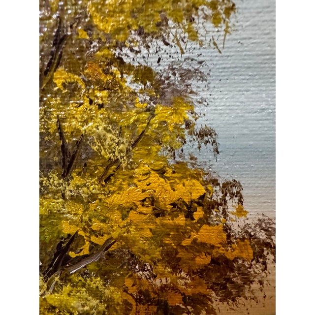 A beautifully textured mid-century landscape oil painting presented in an ornate carved gilt wood frame. This piece...