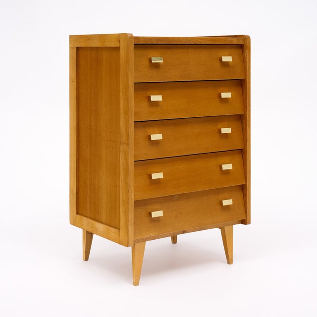 Chiffonier from the mid-century modern period in France. This piece is made of solid wood construction, primarily cherry...
