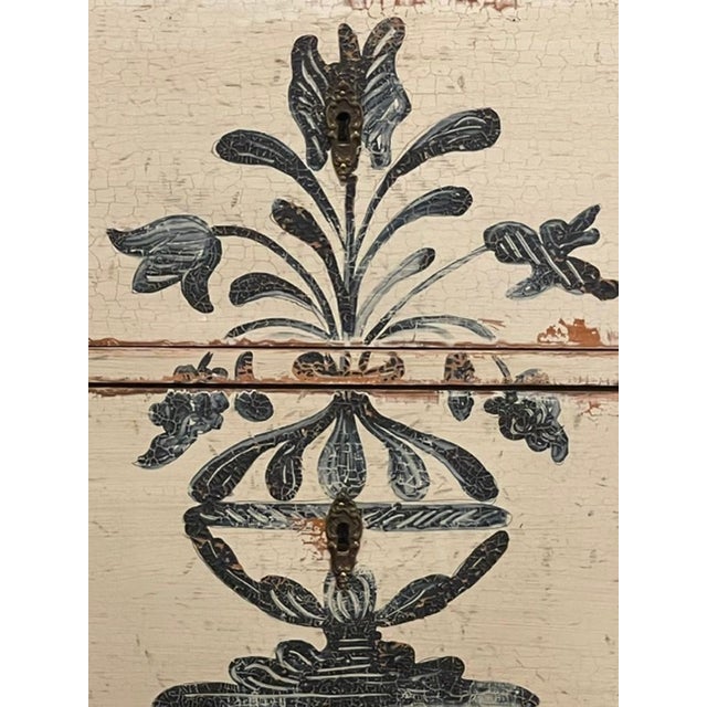 These German Neoclassical hand painted side tables feature painted blue and white design. The tables have 2 drawers for...