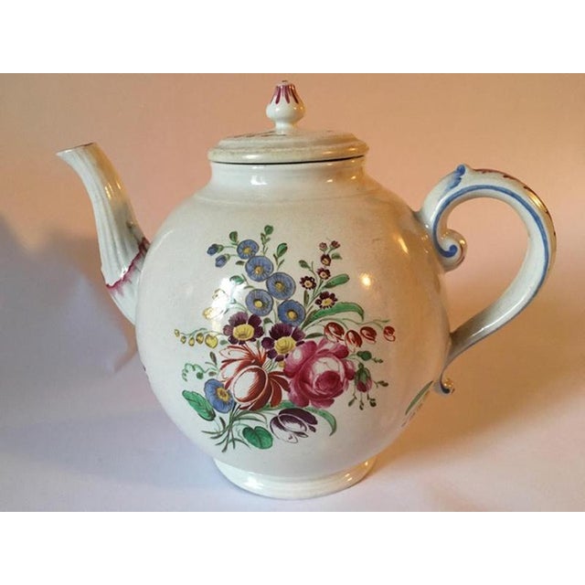 Doccia, Richard Ginori 1750 porcelain tea pot with multi-color floral drawings, Italy. This porcelain tea pot with...