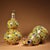 This charming pair of double-gourd vases is crafted from a gilt bronze body and richly decorated with hand-painted...