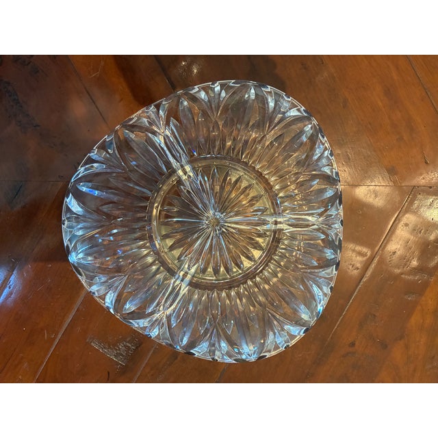 This little serving dish is lead crystal. The flower design is molded, not cut or etched, but pretty nonetheless. It is...