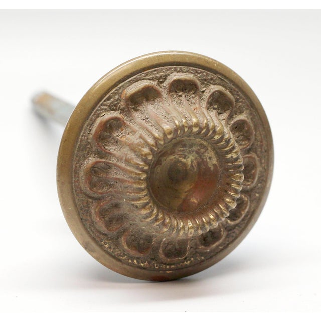 Bronze radial design doorknob. It is part of the L-12810 group. The manufacturer and date of creation is unknown. One...
