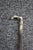 Antique riding crop featuring a decorative sterling silver horse hoof handle with engraved scrollwork detailing. The...