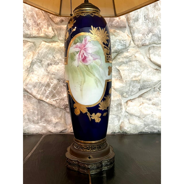 JAPANESE NIPPON COBALT PORCELAIN LARGE VASE, elongated ovoid form, having polychrome hand-painted medallions to each side...