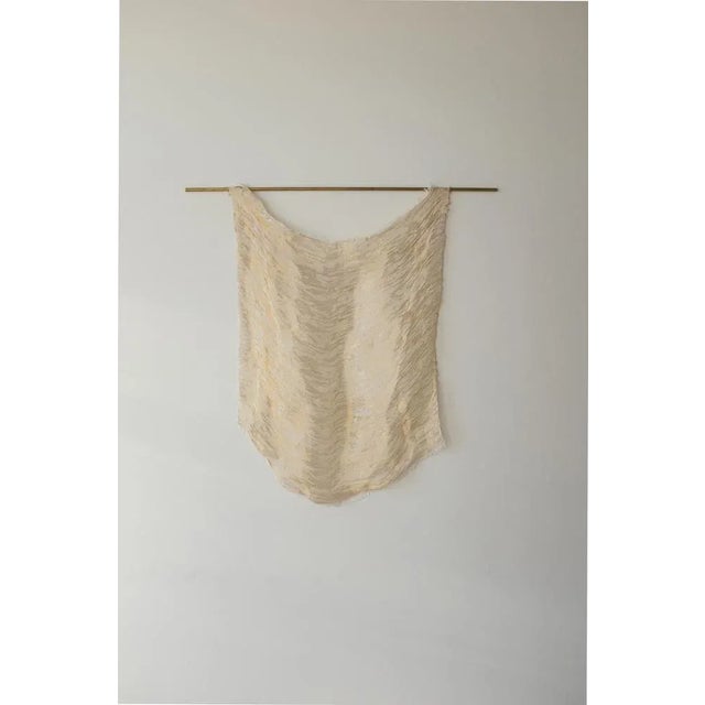 Arpeggi by Nathalie Van der Massen Dimensions: 100 x h 70 cm Materials: Brass, bio cotton. Technique: Manually woven....