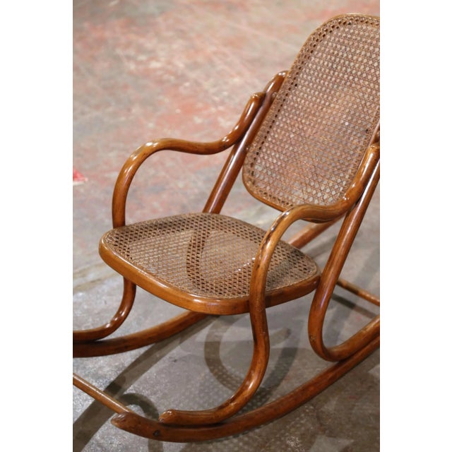 Decorate a child’s room or nursery with this charming antique bentwood rocking chair crafted in France circa 1920 in the...
