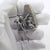 Vintage solid silver narrative miniature figurine depicting a hunter seated with his dog in front of a fireplace, crafted...