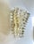 Elegant pair of Italian wall sconces crafted in clear Murano glass with "spikes" that light-reflecting and made...