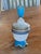 19th century French blue and white opaline glass dresser jar. The frosted white bowl is painted with a trailing vine and...