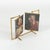 Midcentury amazing swivel double picture frame in brass and acrylic in the style of Paul Lobel. The double frame swivels...