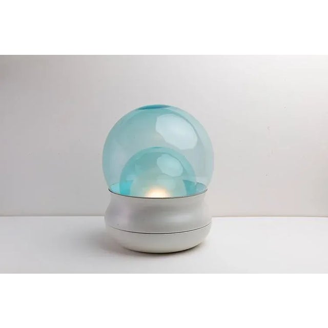 Table lamp with painted metal base and transparent murano glass spheres and celestial stylnovo production period 1969...