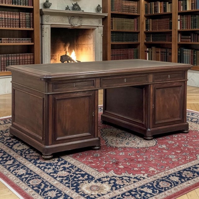 19th Century French Louis Philippe Period Executive Desk in Mahogany with Leather Top embodies the dignified simplicity...