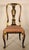 Queen Anne style black chinoiserie decorated side chair, circa 1950. Crest rail with central pagoda decoration, flanked by...