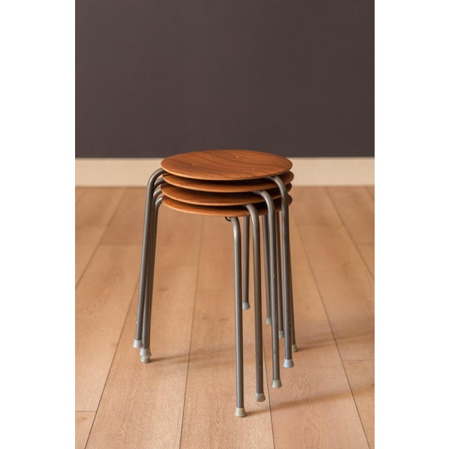 Mid century modern round sitting dot stool side table, made in Denmark, circa 1960s. Features a curved teak table top and...