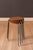 Mid century modern round sitting dot stool side table, made in Denmark, circa 1960s. Features a curved teak table top and...