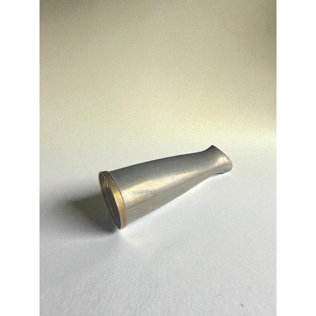 Elegant swedish art deco vase produced by jlh in 1957. Crafted in pewter with a contrasting solid brass base, the piece...