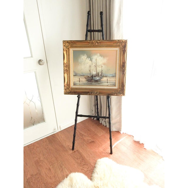 A classic vintage faux bamboo floor easel crafted from wood with an elegant dark brown finish and timeless faux bamboo...