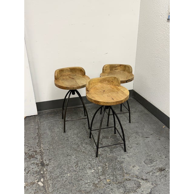 Design Plus Gallery presents the Set of Three Henson Counter Stools from Arteriors. Each rustic stool combines a...