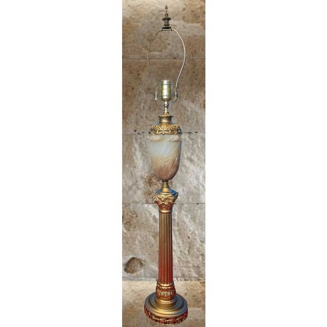 Illuminate your space with this exquisite table lamp, a stunning embodiment of neoclassical elegance and artistic...