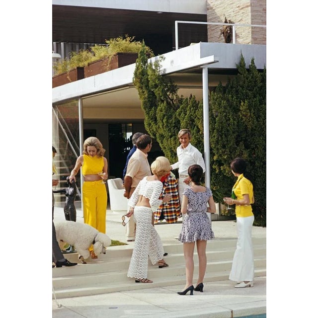 Poolside Chic 1970 by Slim Aarons Slim Aarons Limited Estate Edition Guests by the pool at Nelda Linsk’s desert house in...