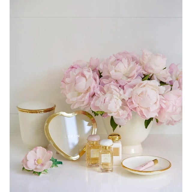 Hand-crafted in Italy, this lidded pot holds a three-wick scented candle. The pot has been enhanced using a glazing...