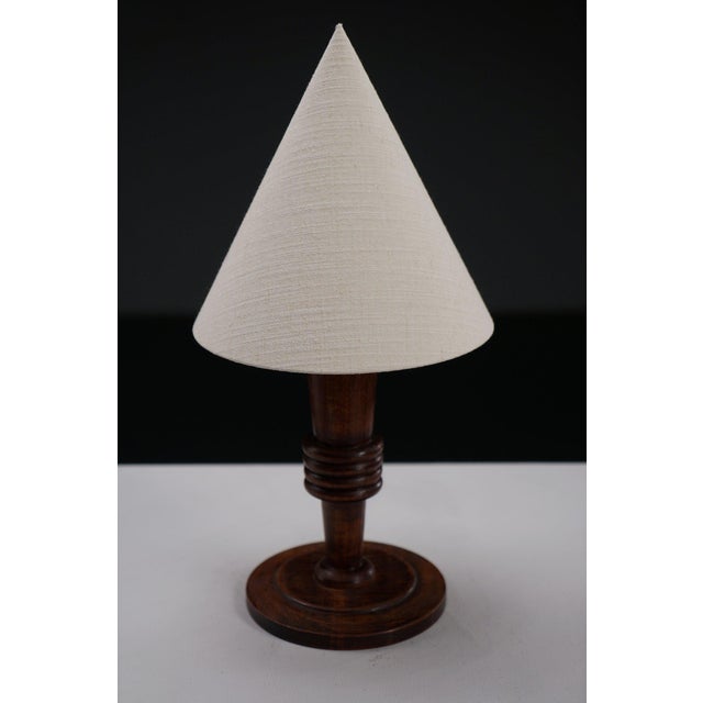 period: 1940s origin: France dimensions: h52 x w24 x d24 cm material: wood, new linen shade I have official proof of...