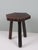 A sculptural mid-20th-century stool handcrafted in Spain, carved from solid wood and defined by its expressive vernacular...