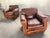 A stunning pair of vintage-inspired French Art Deco leather club chairs. Crafted in a classic Parisian silhouette, these...