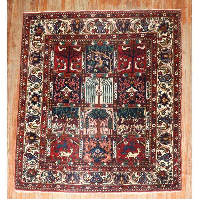 Square-size Persian Bakhtiari rug with an all-over garden box design from the 3rd quarter of the 20th century Measures:...