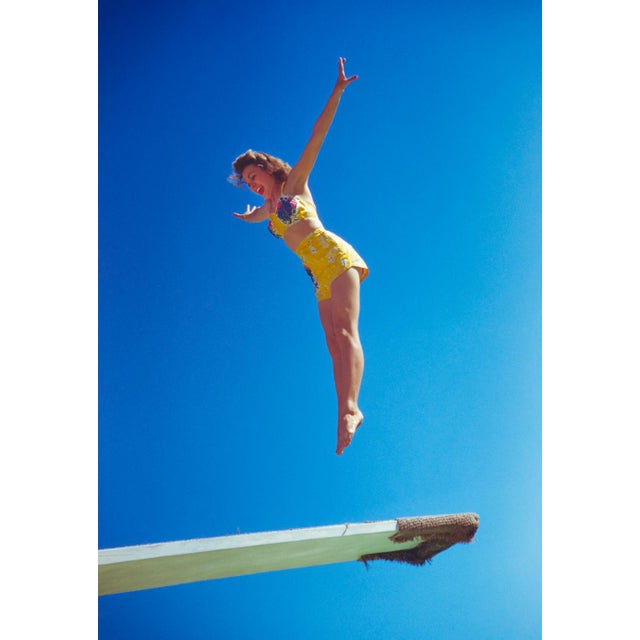 Reach For The Sky by Toni Frissell A Vogue fashion shoot featuring a model on a diving board, Florida, USA, 1944. (Photo...