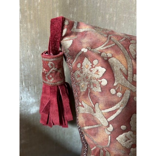 A pillow made with Fortuny’s iconic hand printed fabric, embellished with handmade tassels.