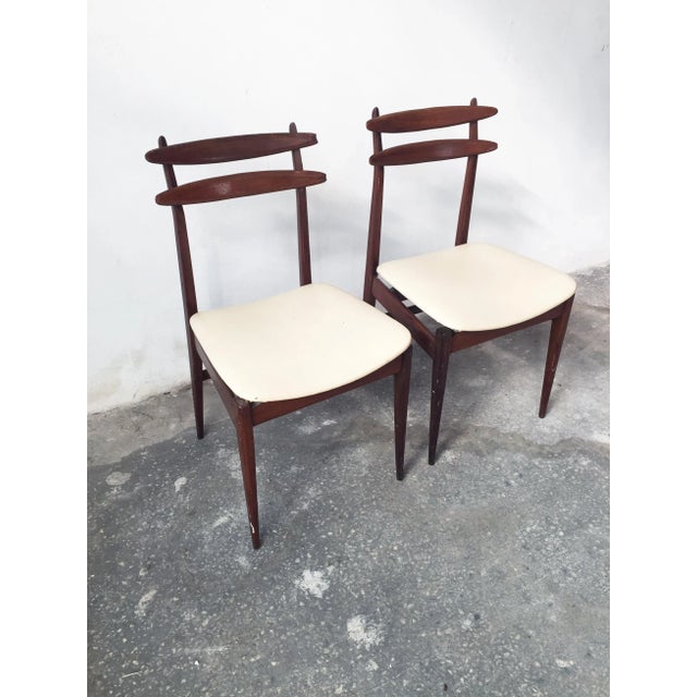 - Pair of chairs made in Italy during the 1950s - Made from dark mahogany - Padding in good condition