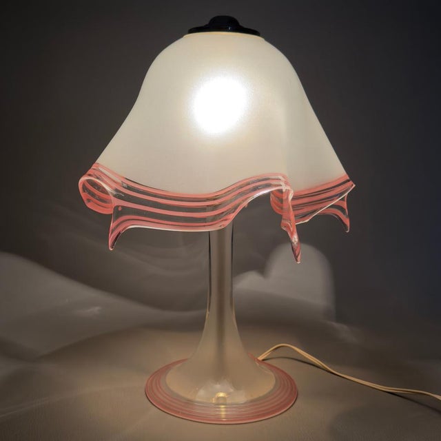 A true work of glass art that captivates at first glance. This extremely rare and precious Murano glass table lamp is a...