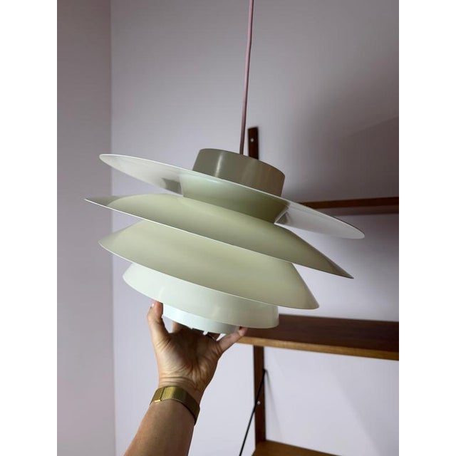 An icon of Scandinavian lighting design: The Verona pendant lamp, designed by Svend Middelboe for Nordisk Solar, is a...