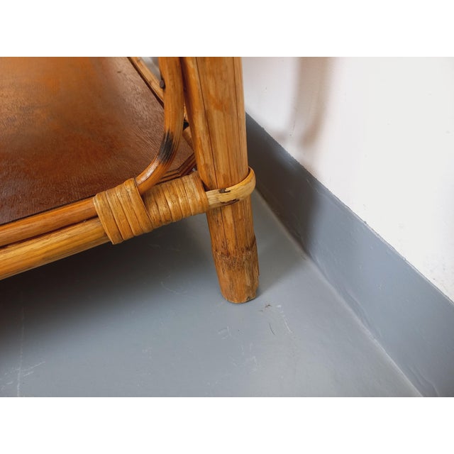 Vintage coffee table, in rattan and two wooden tops. Good general condition, some small losses of rattan at the bottom of...
