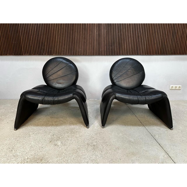 This rare pair of 'Calypso C35' lounge chairs, designed in 1979 by renowned Italian designer Vittorio Introini and...