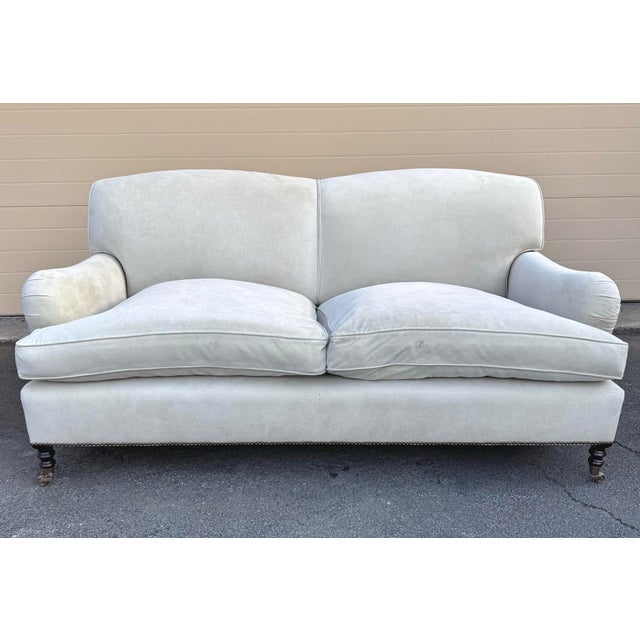 George Smith Standard Arm Sofa in beige microsuede with down seat cushions. The sofa sits on turned legs with antiqued...