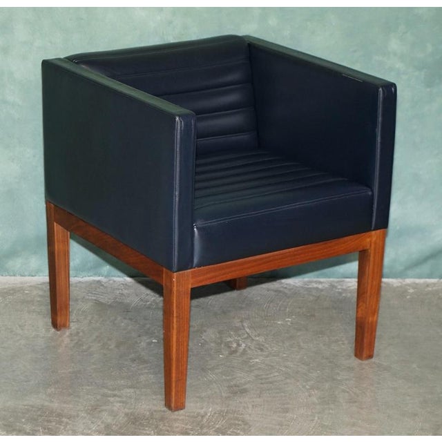 Superb pair of Viscount David Linley “Dice” Carver armchairs, with Walnut Frames and Black leather upholstery The original...