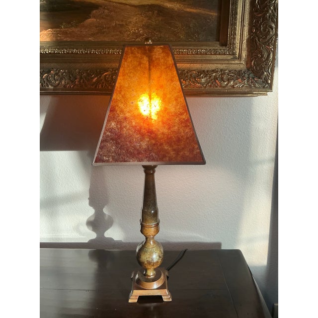 A striking vintage Wescal table lamp featuring a richly patinated metal body paired with a dramatic faux tortoiseshell...