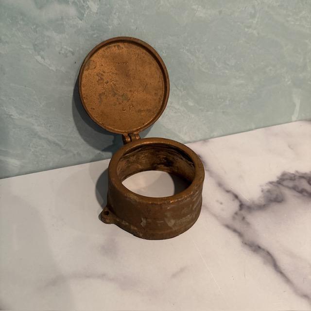 Neat antique water meter cover. Installed in Newark, New Jersey. Made of brass in the United States by Wothington-Gamon....